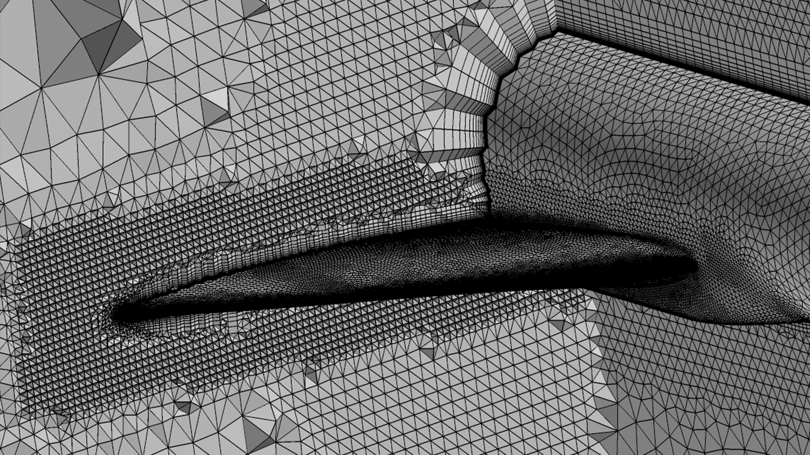 Malha híbrida na junção asa-pilone de um modelo de referência, com camadas prismáticas e transição para tetraedros.