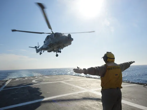 Helicopter landing on the flight deck of a ship